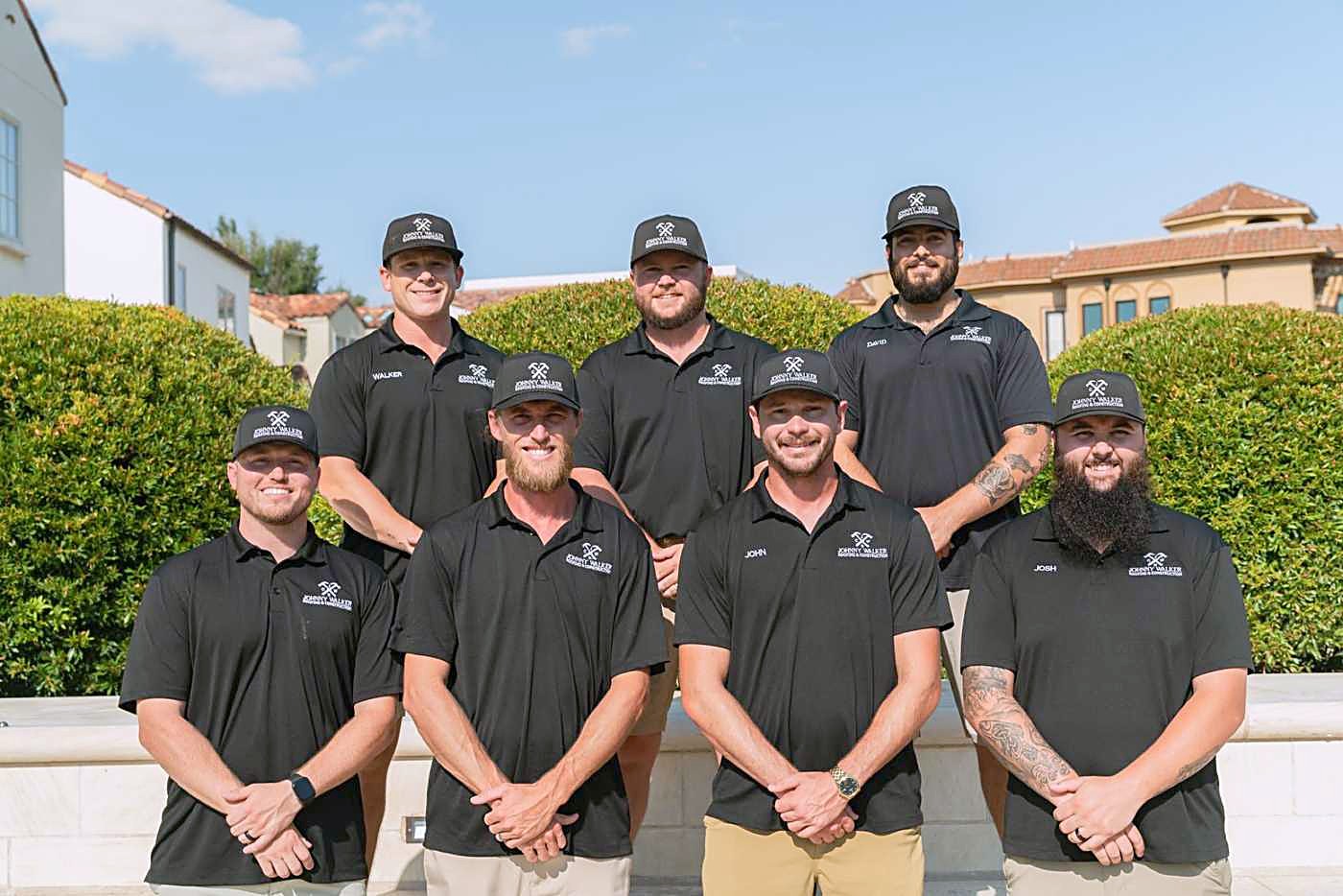 The Johnny Walker Roofing team in black company polos